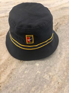 Nike Black Bucket Hat with Yellow Trim and Embroidered Crest